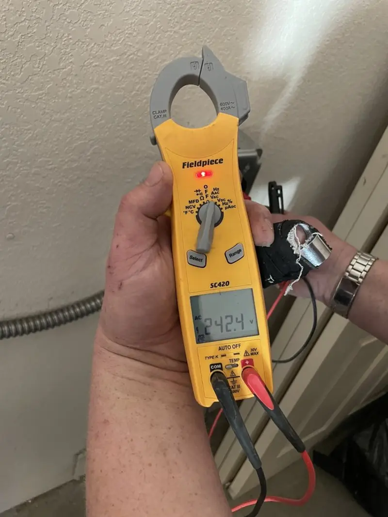 Voltage testing with clamp meter during Circuit Breaker Repair in Fort Ann